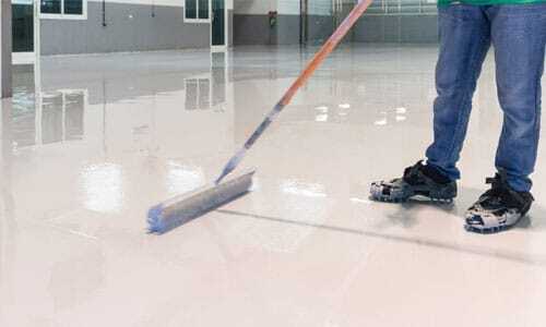 4-Epoxy-Flooring-in-Irvine,-CA man maintains floor